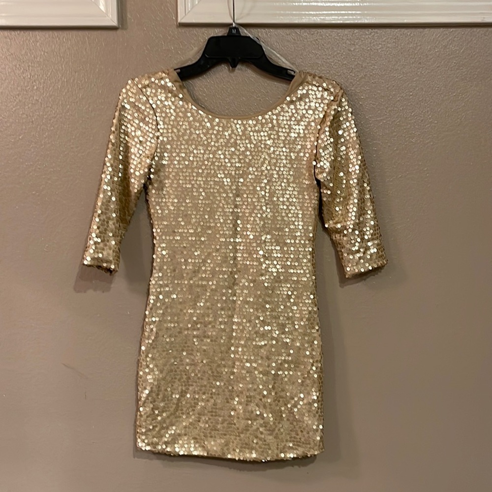 This gold sequenced dress is short!
